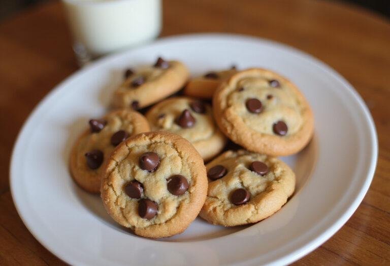 Delicious quick bites snack cookies displayed on a plate next to a glass of milk, showcasing their perfect bite-sized appeal in a cozy home setting.